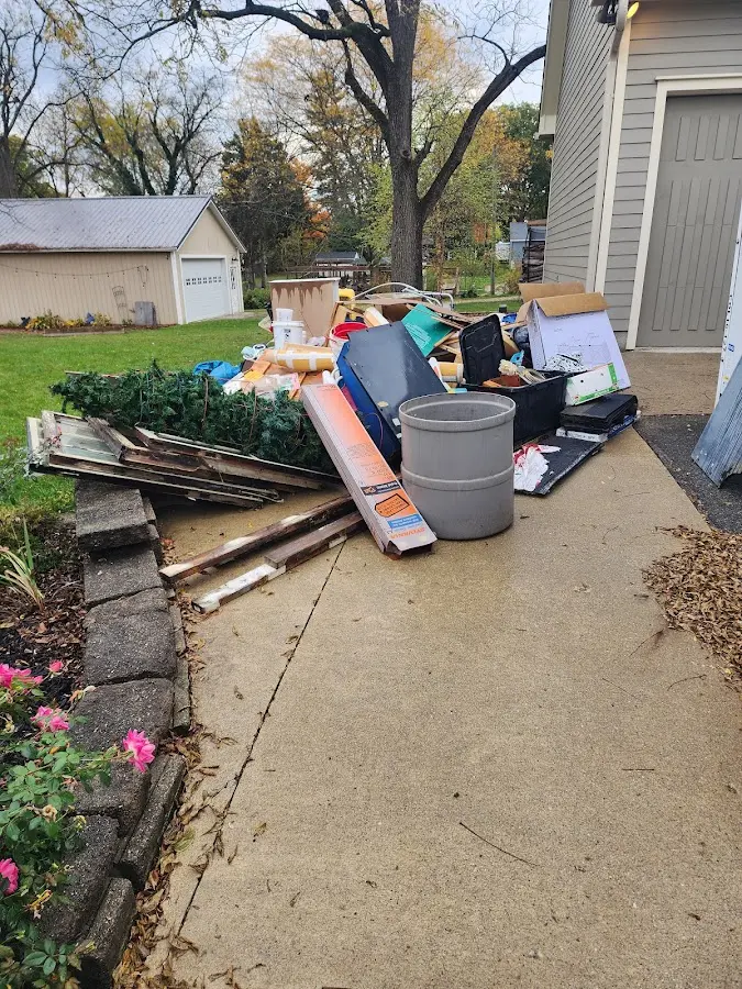 Dumpster being loaded with debris for Commercial Dumpster Rental in Crestwood